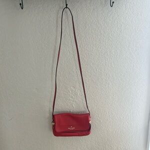Small kate space cross body purse, reddish orange